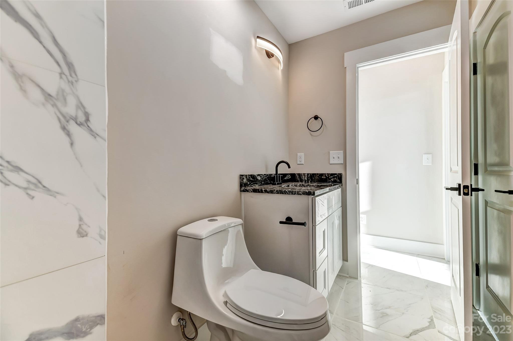 4308 White Tail Lane Midland, NC 28107 - Photo 29 of 37 a white toilet sitting next to a bathroom sink