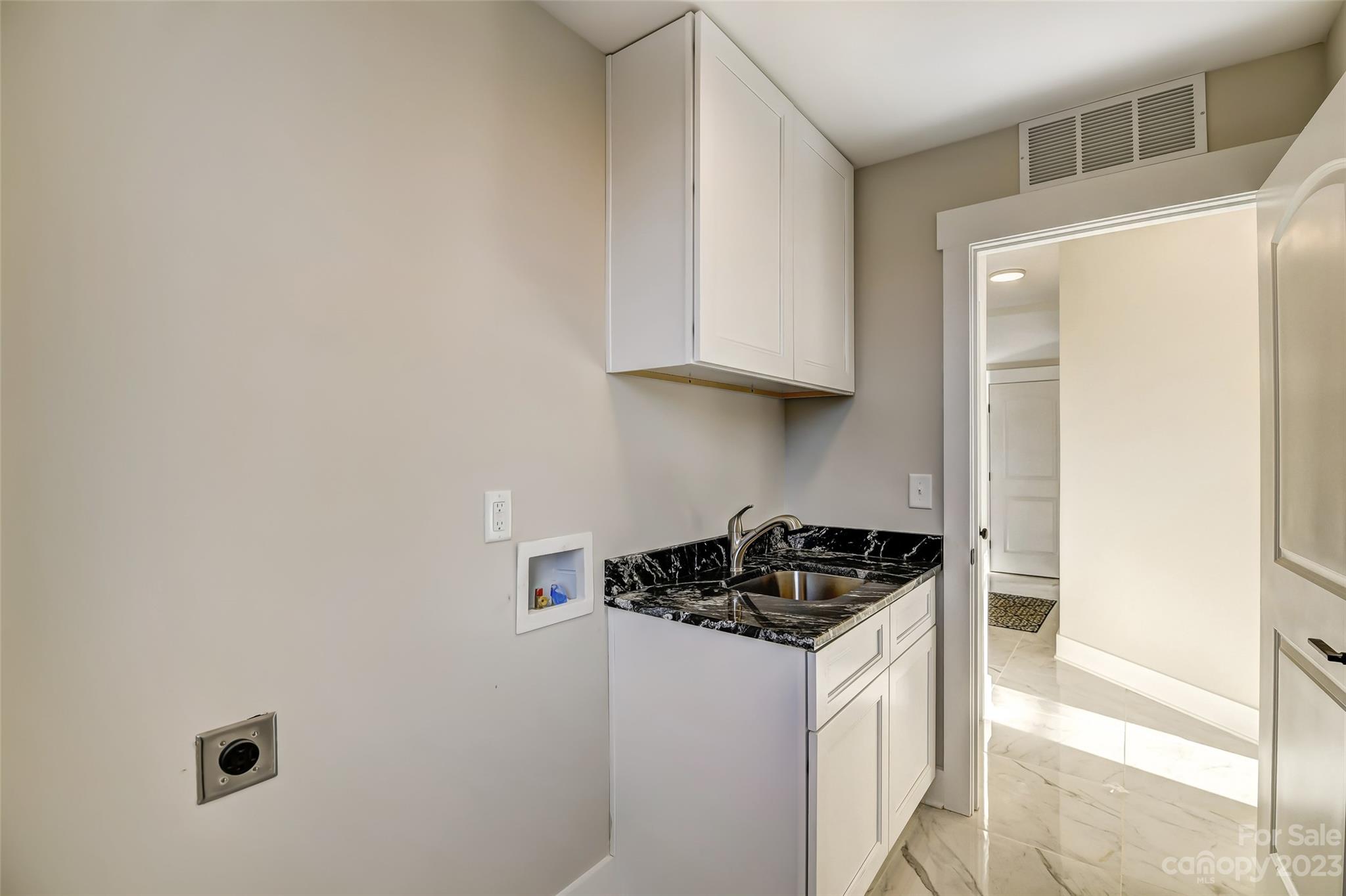 4308 White Tail Lane Midland, NC 28107 - Photo 31 of 37 a kitchen with a sink and cabinets