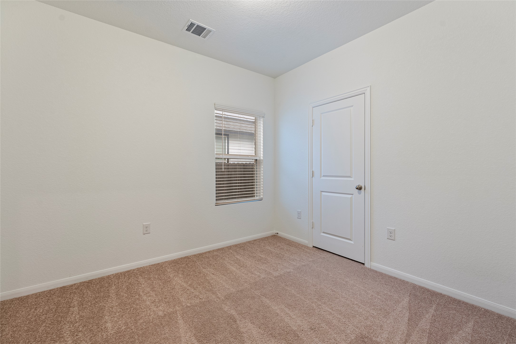 149 Biscayne Drive Kyle, TX 78640 - Photo 11 of 20 a view of an empty room with a window