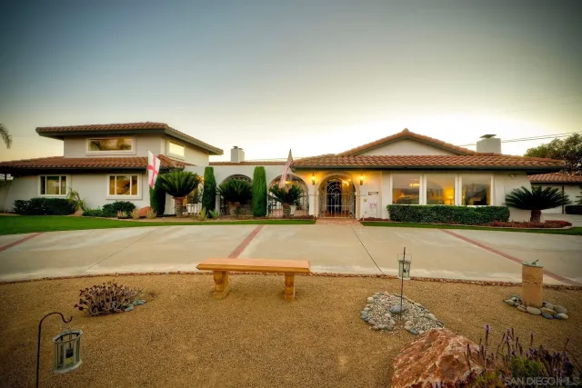 a front view of a house with yard
