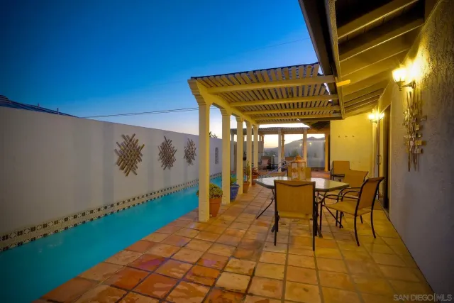 a view of a backyard with sitting area