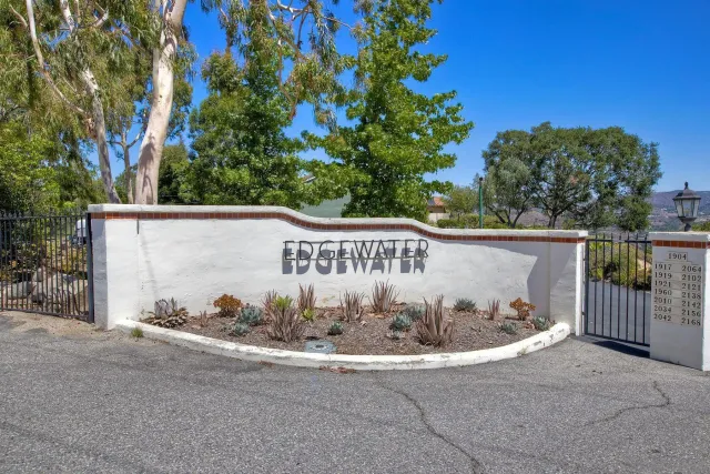 a living room with furniture a fireplace and a table