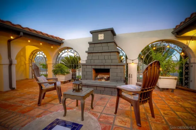 a view of a patio with a table and chairs