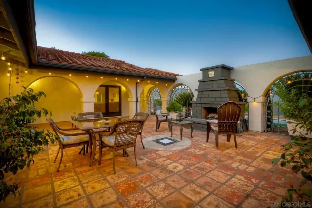 a living room with furniture potted plant and a rug