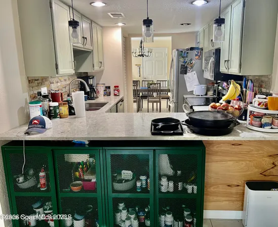 a kitchen with lots of counter top space and a sink