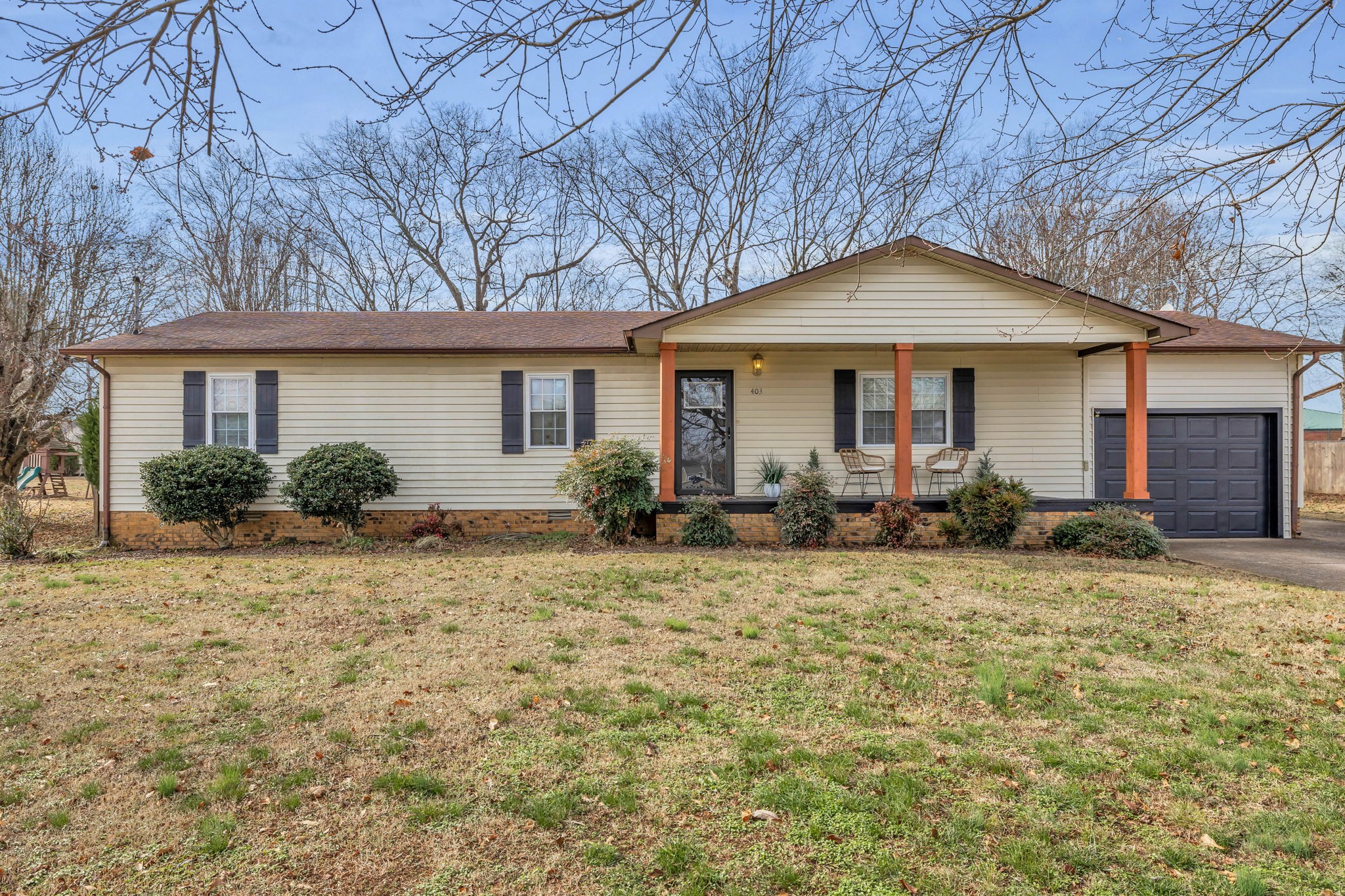 a front view of a house with garden
