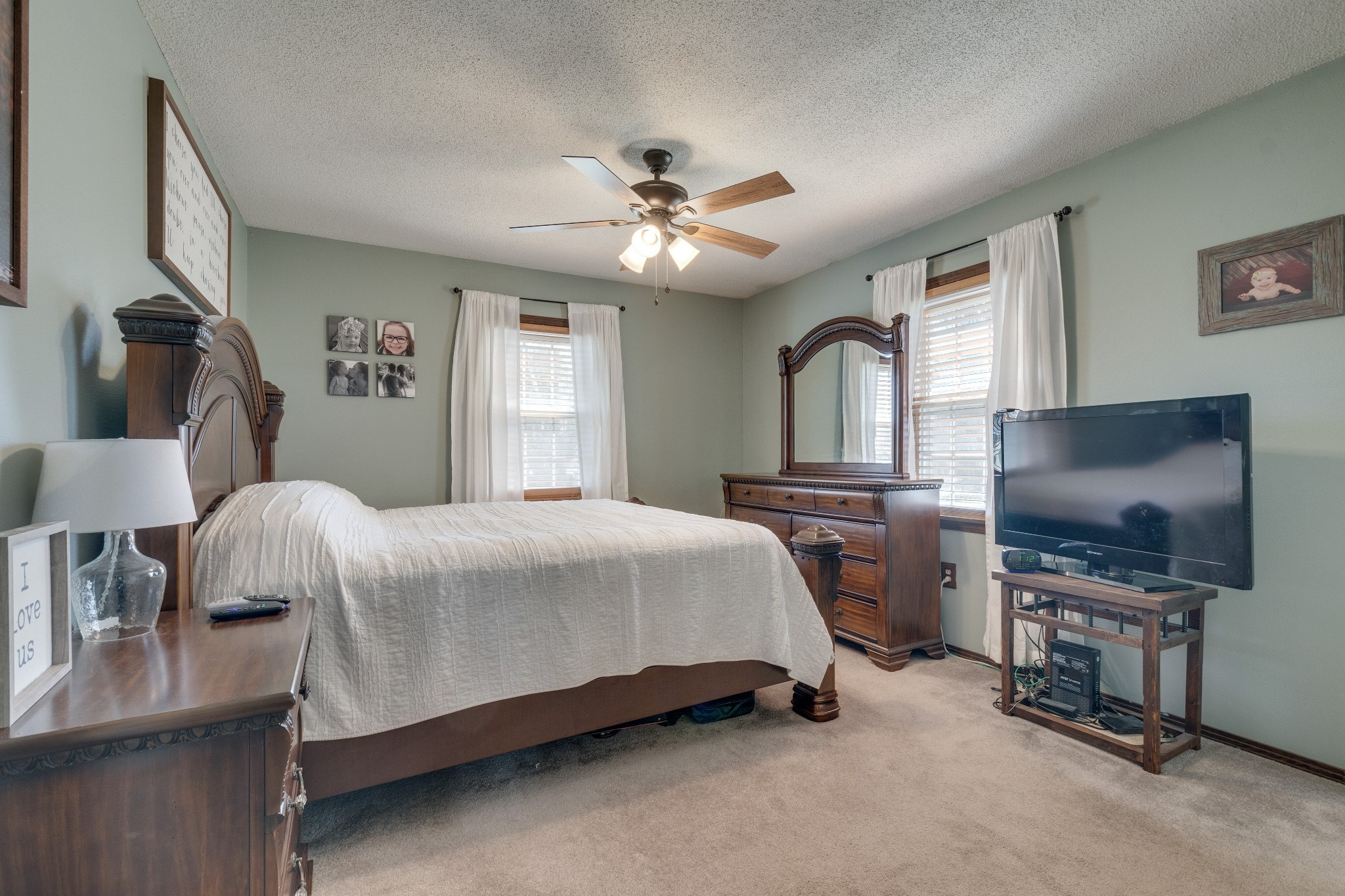 403 Mockingbird Drive Mount Pleasant, TN 38474 - Photo 16 of 26 a bedroom with a bed and a flat screen tv