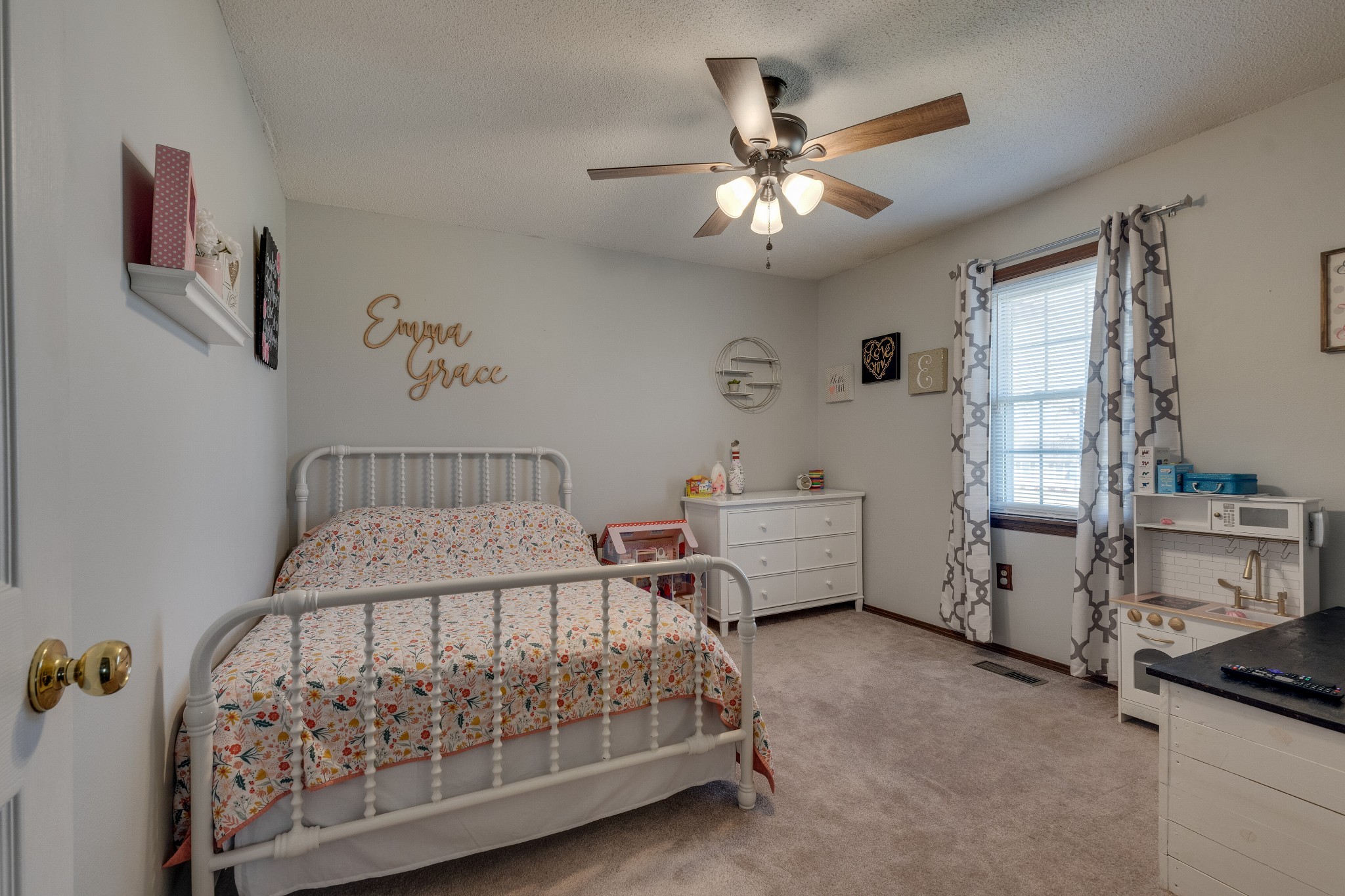 403 Mockingbird Drive Mount Pleasant, TN 38474 - Photo 18 of 26 a bedroom with a bed and a chandelier