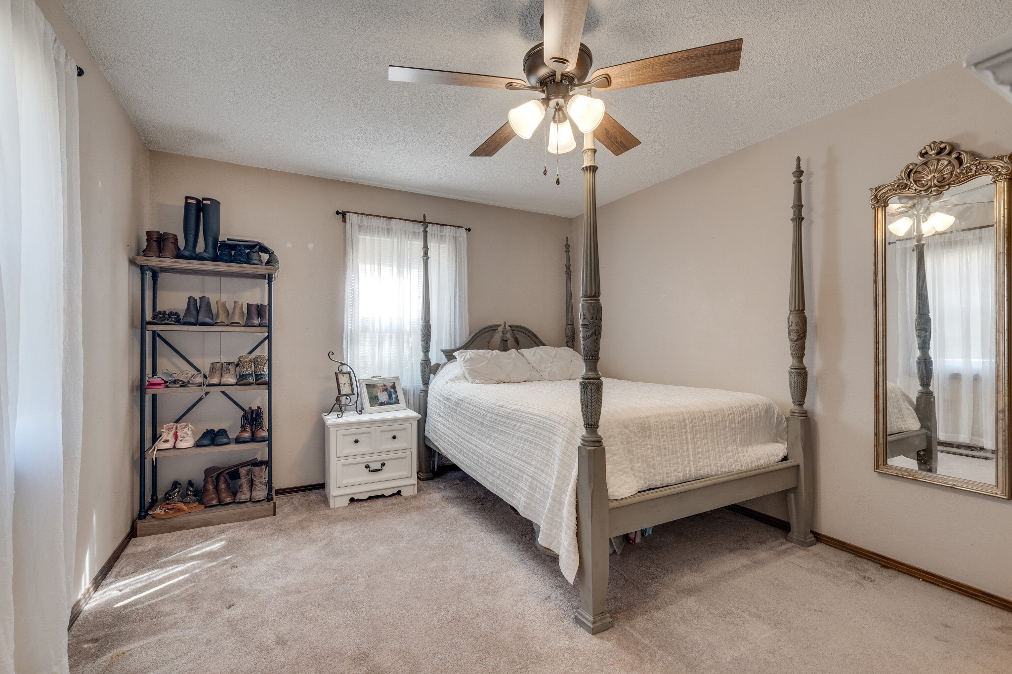 403 Mockingbird Drive Mount Pleasant, TN 38474 - Photo 19 of 26 a bedroom with a bed and a chandelier