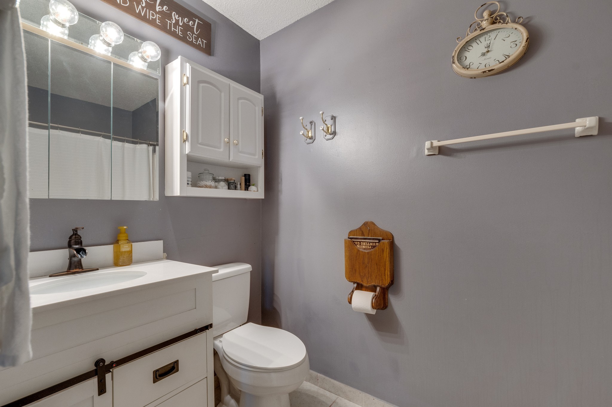 403 Mockingbird Drive Mount Pleasant, TN 38474 - Photo 20 of 26 a bathroom with a toilet a sink and vanity
