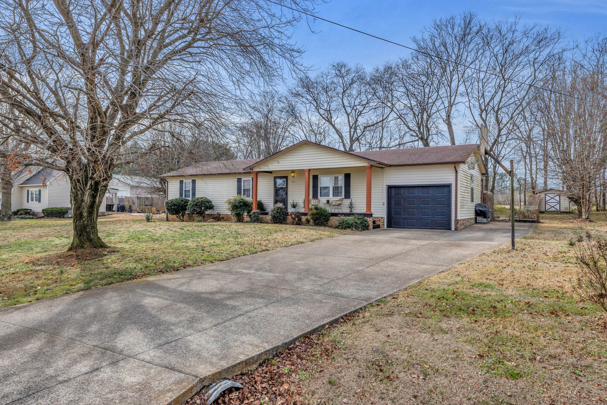 403 Mockingbird Drive Mount Pleasant, TN 38474 - Photo 2 of 26 a front view of a house with a yard and garage