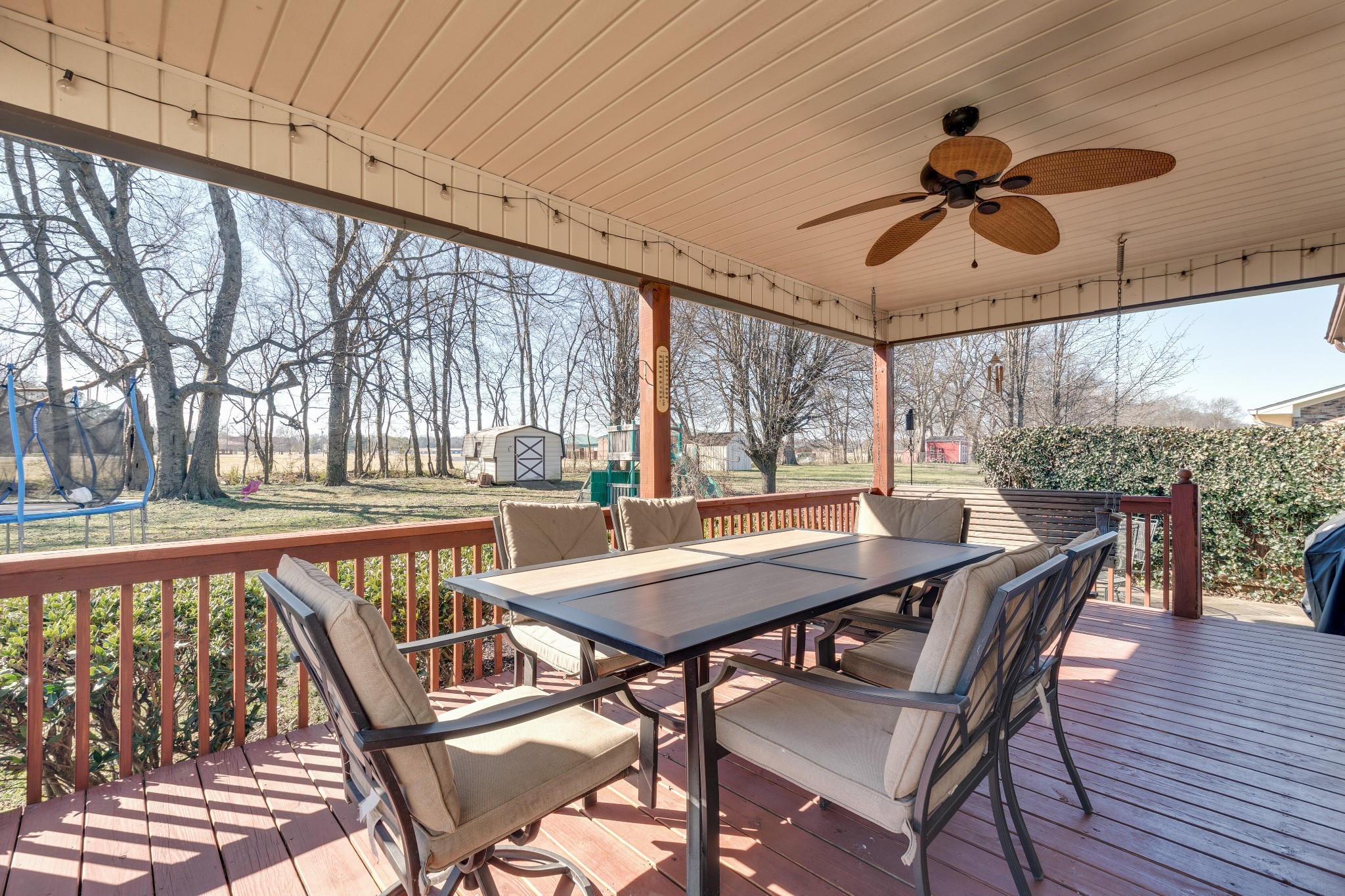 403 Mockingbird Drive Mount Pleasant, TN 38474 - Photo 21 of 26 a view of a patio with a table chairs and a backyard