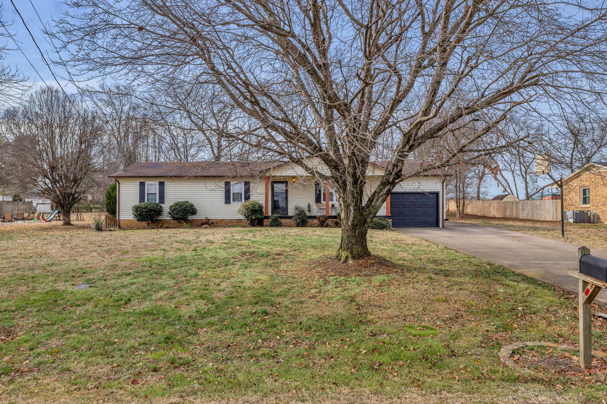 403 Mockingbird Drive Mount Pleasant, TN 38474 - Photo 3 of 26 a tree in the middle of a yard
