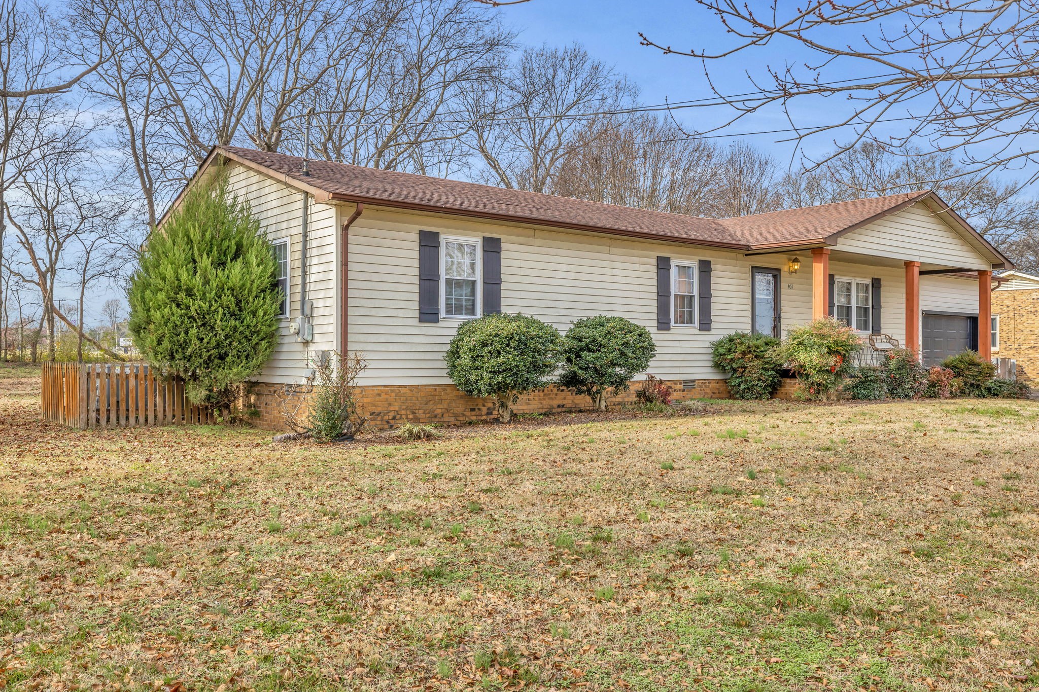 403 Mockingbird Drive Mount Pleasant, TN 38474 - Photo 4 of 26 a front view of house with yard and trees around