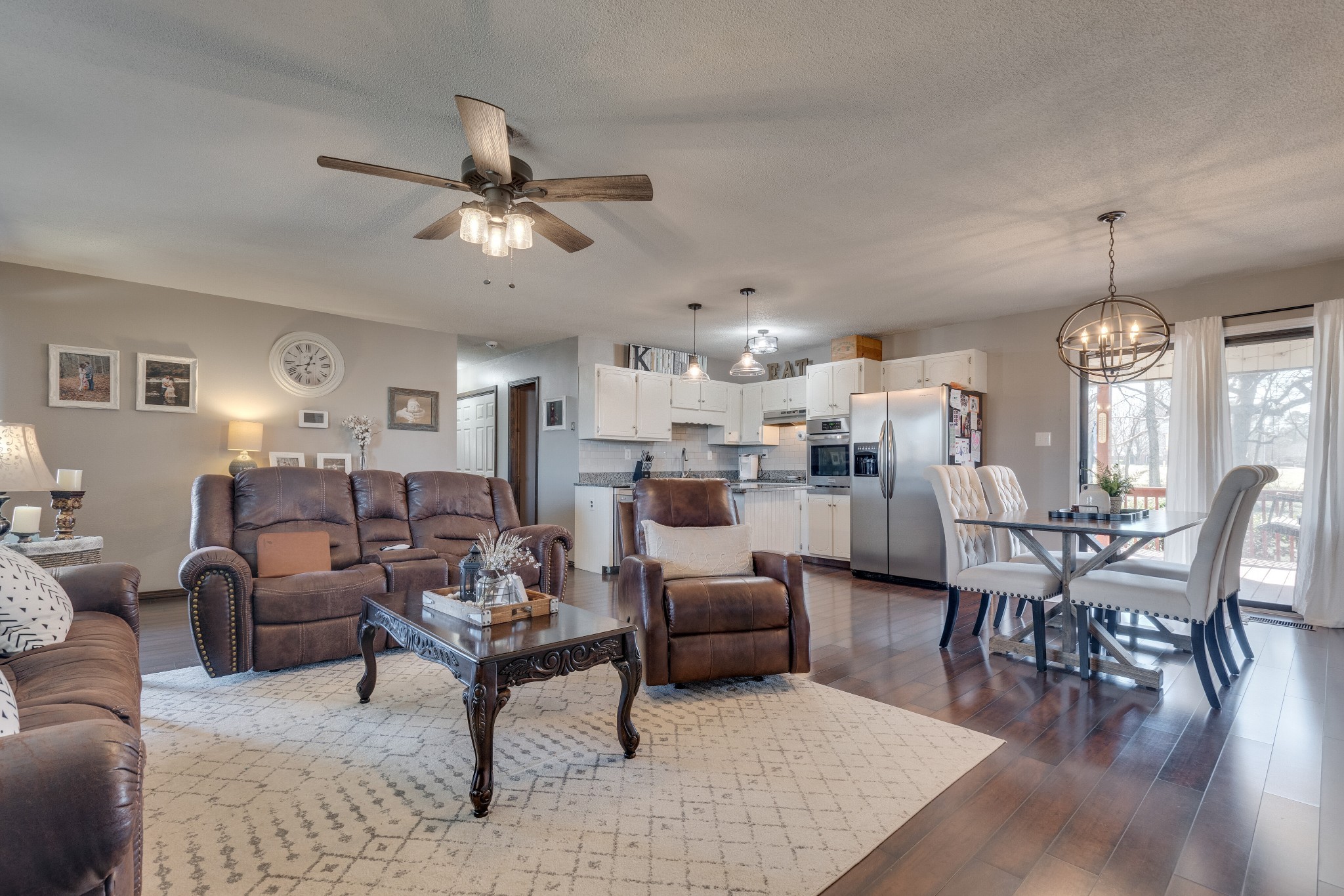403 Mockingbird Drive Mount Pleasant, TN 38474 - Photo 9 of 26 a living room with furniture kitchen view and a chandelier