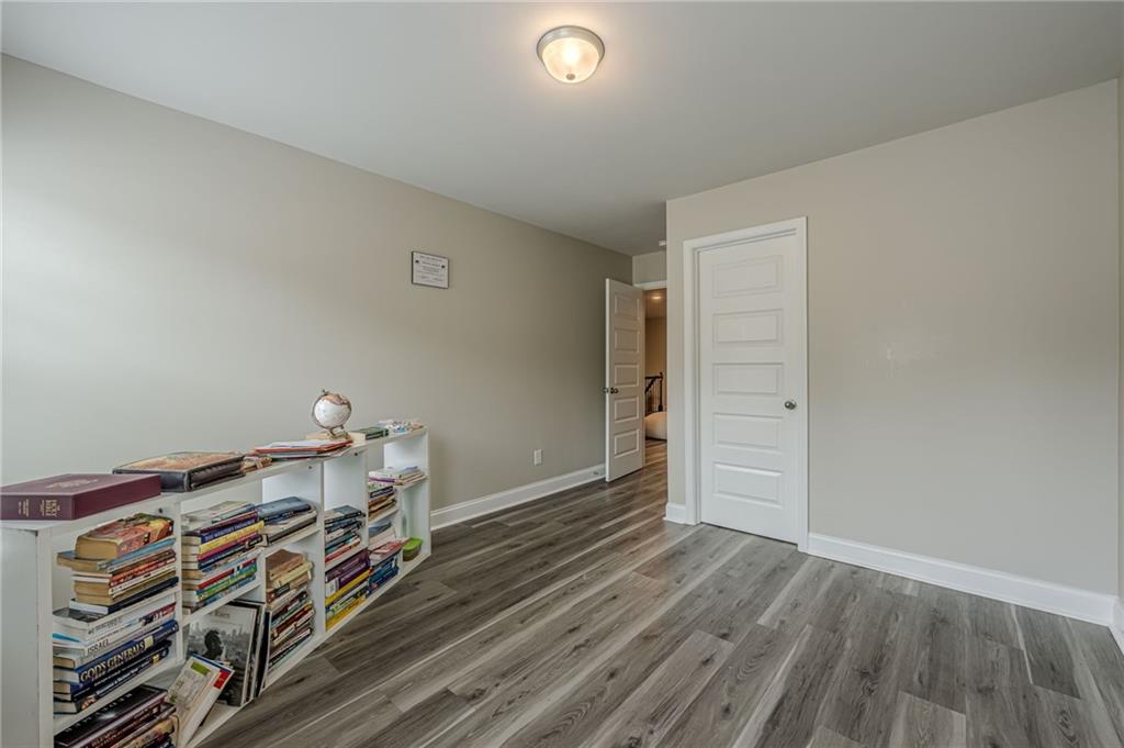 6940 Cedar Glen Road Atlanta, GA 30360 - Photo 22 of 24 a view of room with wooden floor