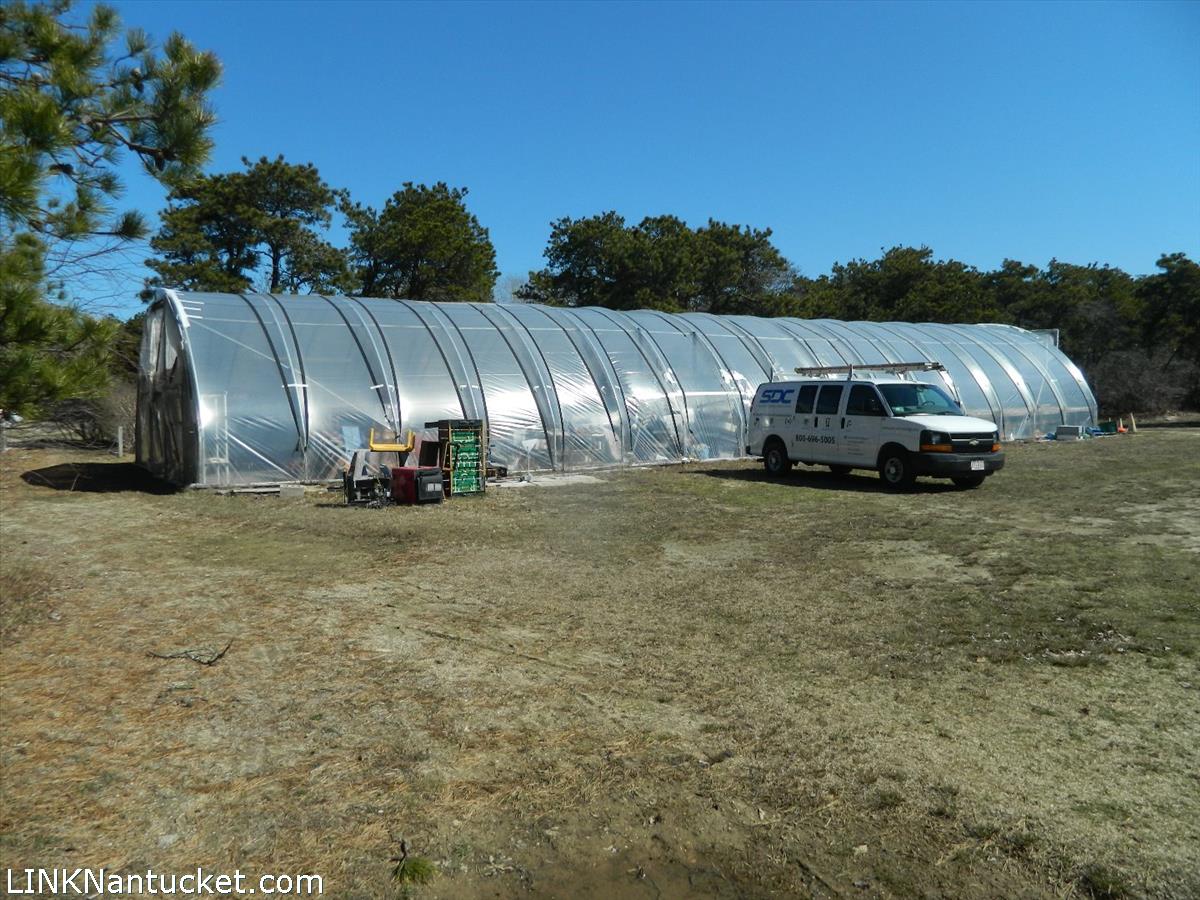 34 Hinsdale Road Nantucket, MA 02554 - Photo 3 of 7 a view of car parked on the side of the road