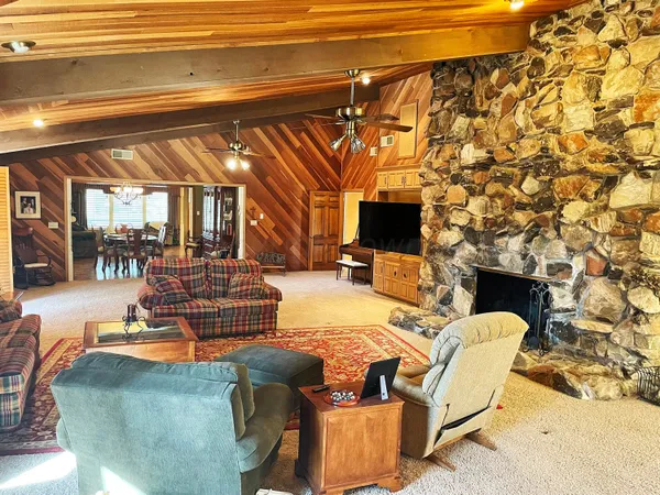 a view of living room with furniture and a flat screen tv
