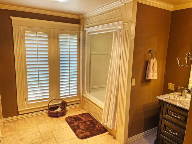 a bathroom with a sink and a window