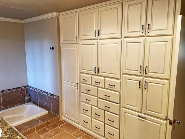 a bathroom with a mirror and a shower