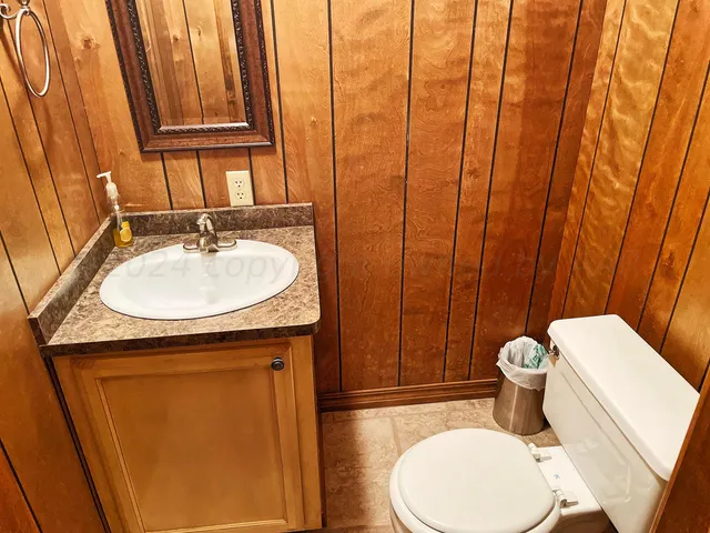 a view of swimming pool with outdoor seating and a yard