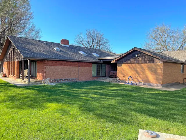 a view of backyard with small cabin