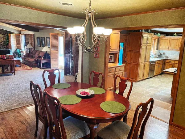 a dining room with furniture and window