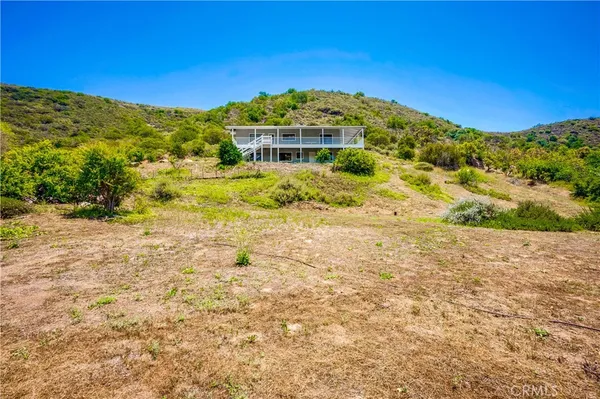 a view of a large building with a mountain in the background
