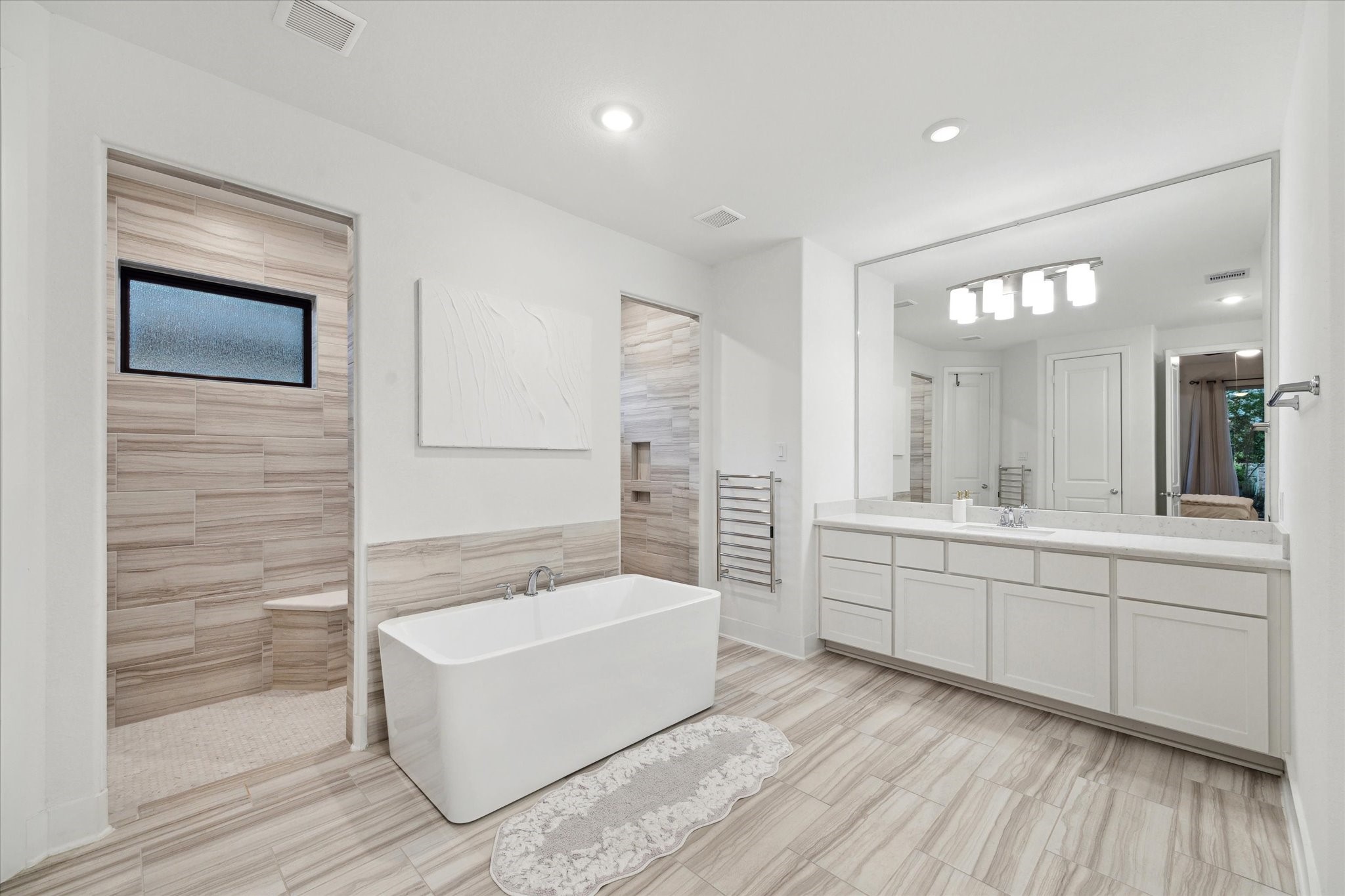 17355 Camillia Trail Conroe, TX 77302 - Photo 14 of 34 a spacious bathroom with a tub sink and mirror