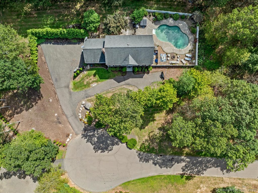 an aerial view of a house with outdoor space