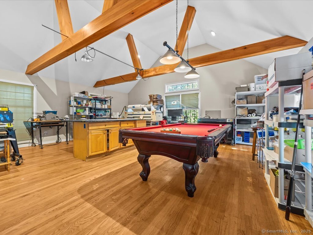 30 Renees Way Madison, CT 06443 - Photo 15 of 40 a living room with a table and chairs