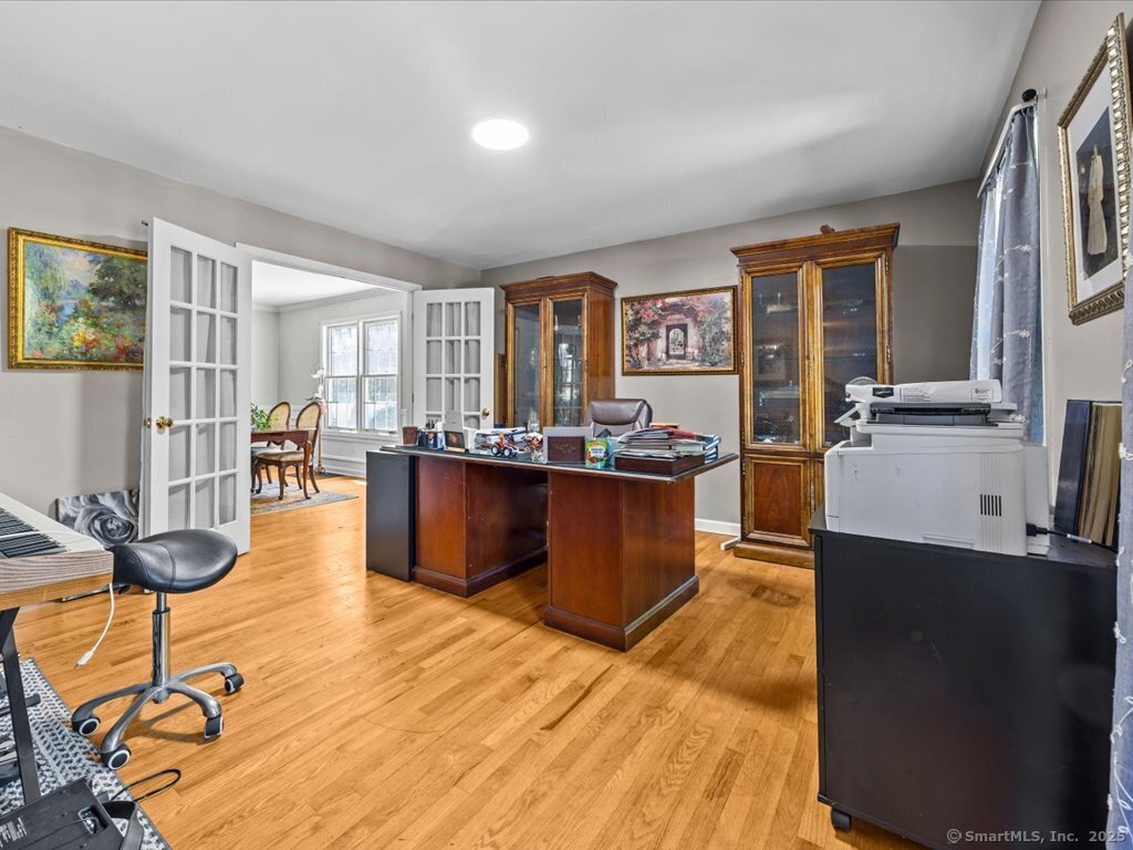 30 Renees Way Madison, CT 06443 - Photo 18 of 40 a living room with stainless steel appliances kitchen island granite countertop a table chairs and a view of kitchen
