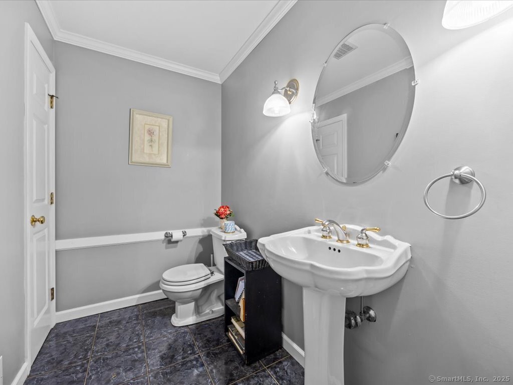 30 Renees Way Madison, CT 06443 - Photo 19 of 40 a bathroom with a sink toilet and a mirror