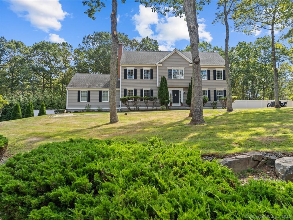 30 Renees Way Madison, CT 06443 - Photo 2 of 40 a front view of a house with a yard