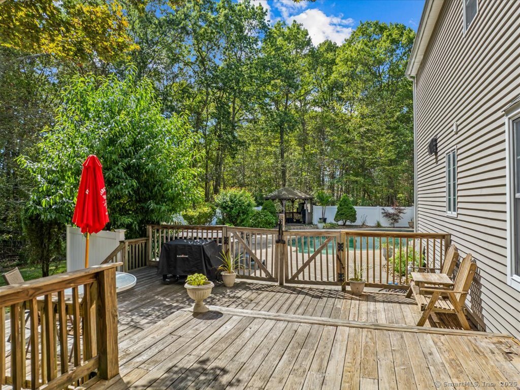 30 Renees Way Madison, CT 06443 - Photo 23 of 40 a view of balcony with wooden floor and outdoor seating