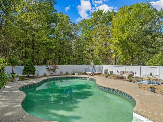 a view of a swimming pool with a patio