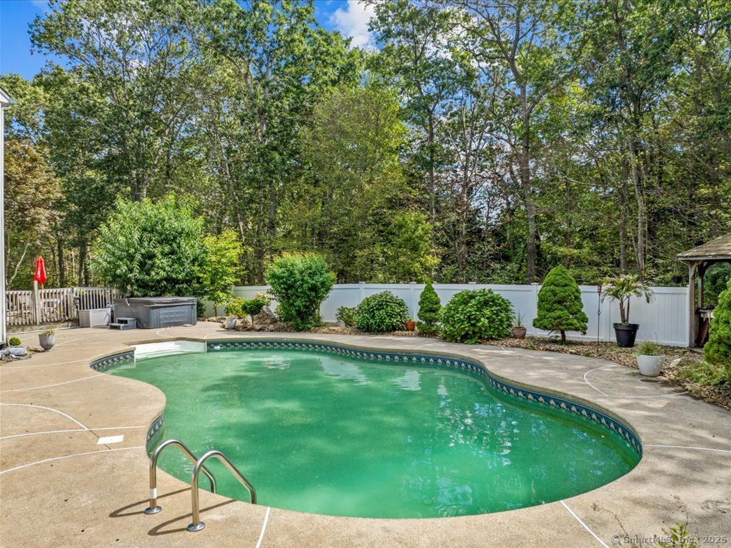 30 Renees Way Madison, CT 06443 - Photo 28 of 40 a view of a swimming pool and sitting area