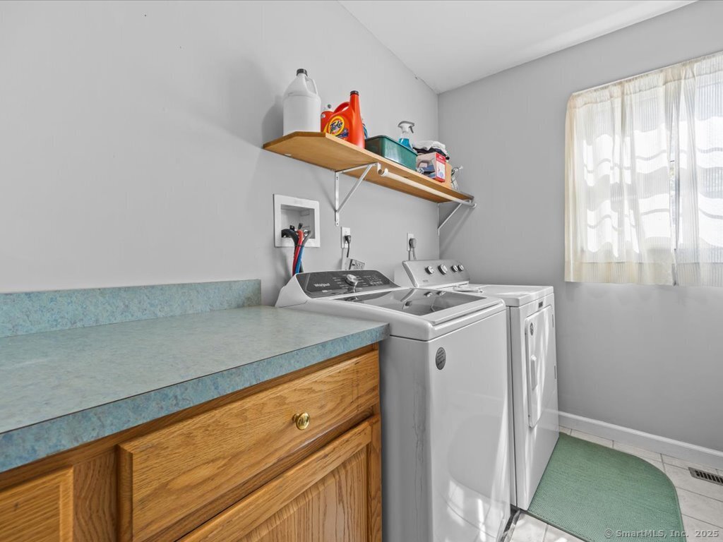 30 Renees Way Madison, CT 06443 - Photo 33 of 40 a utility room with dryer and washer