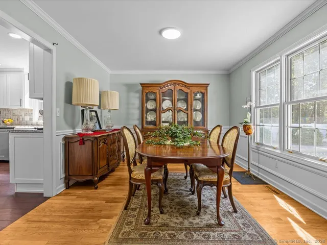 a view of a dining room with furniture and window