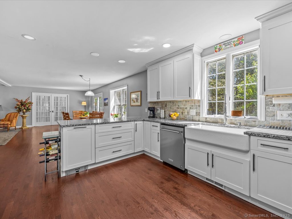 30 Renees Way Madison, CT 06443 - Photo 10 of 40 a kitchen with white cabinets and white appliances