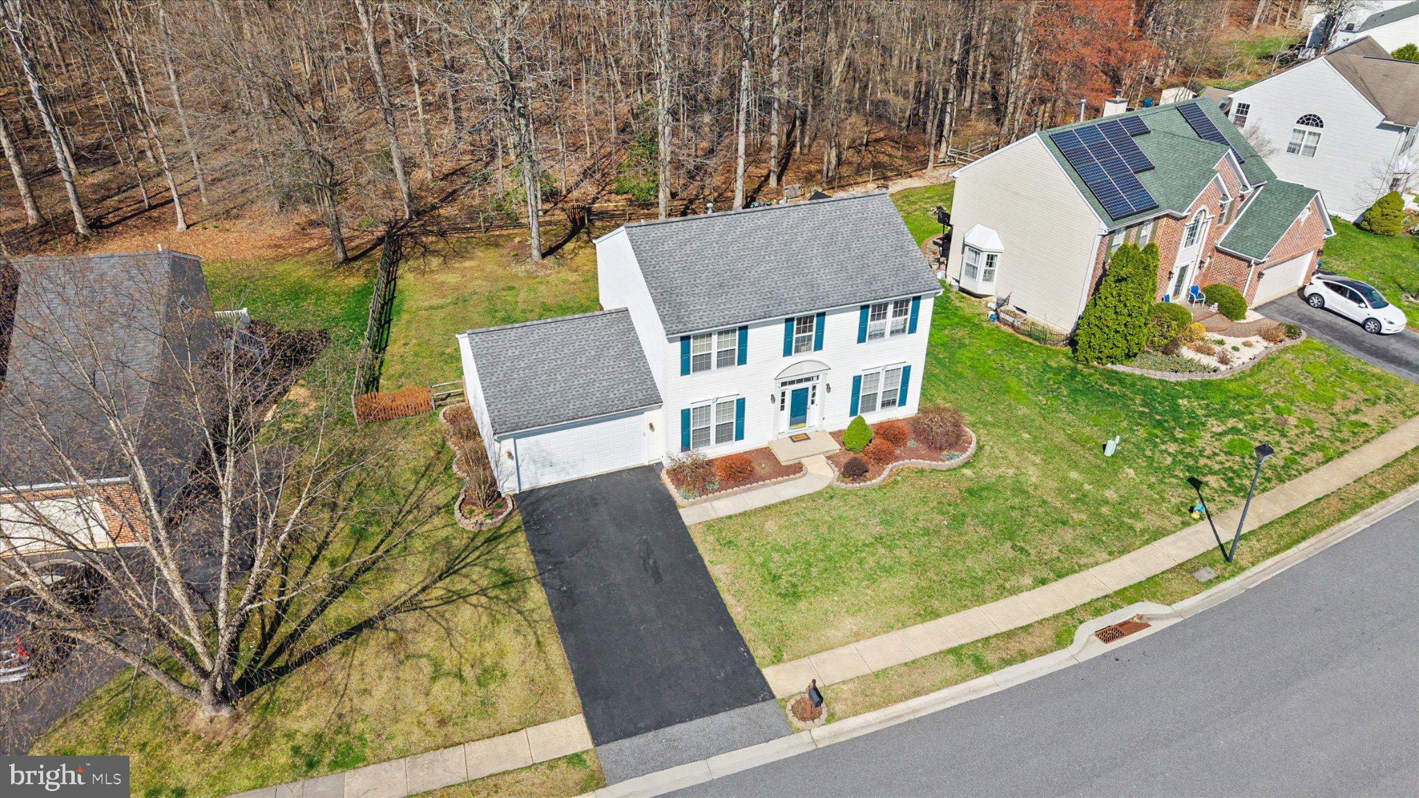front view of a house with a garden