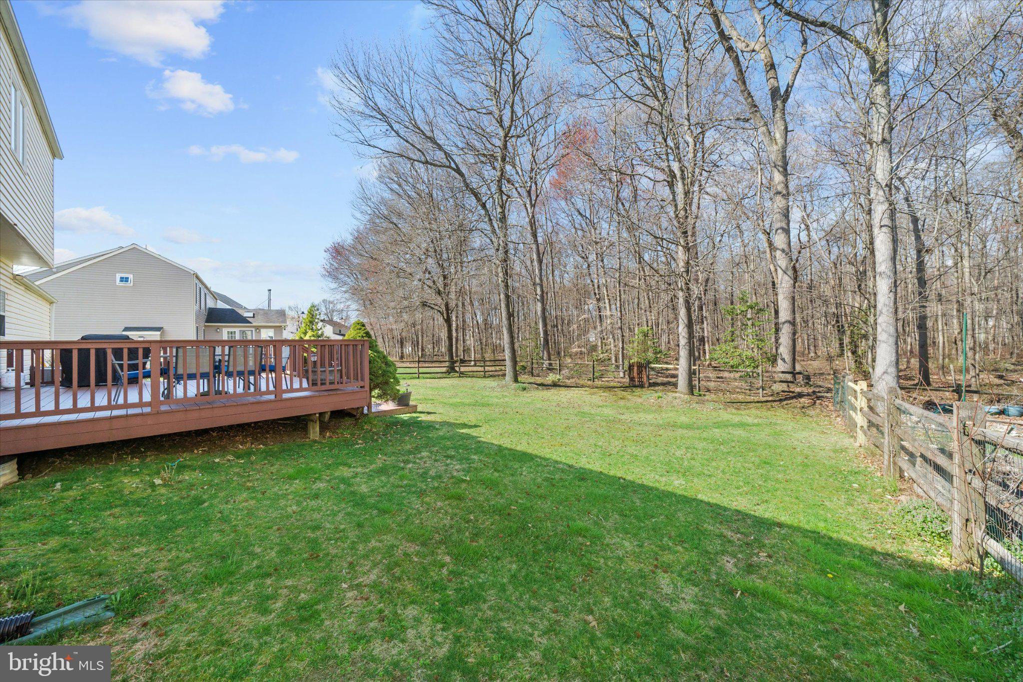 457 Preakness Run Newark, DE 19702 - Photo 18 of 55 a view of a house with a big yard and large trees