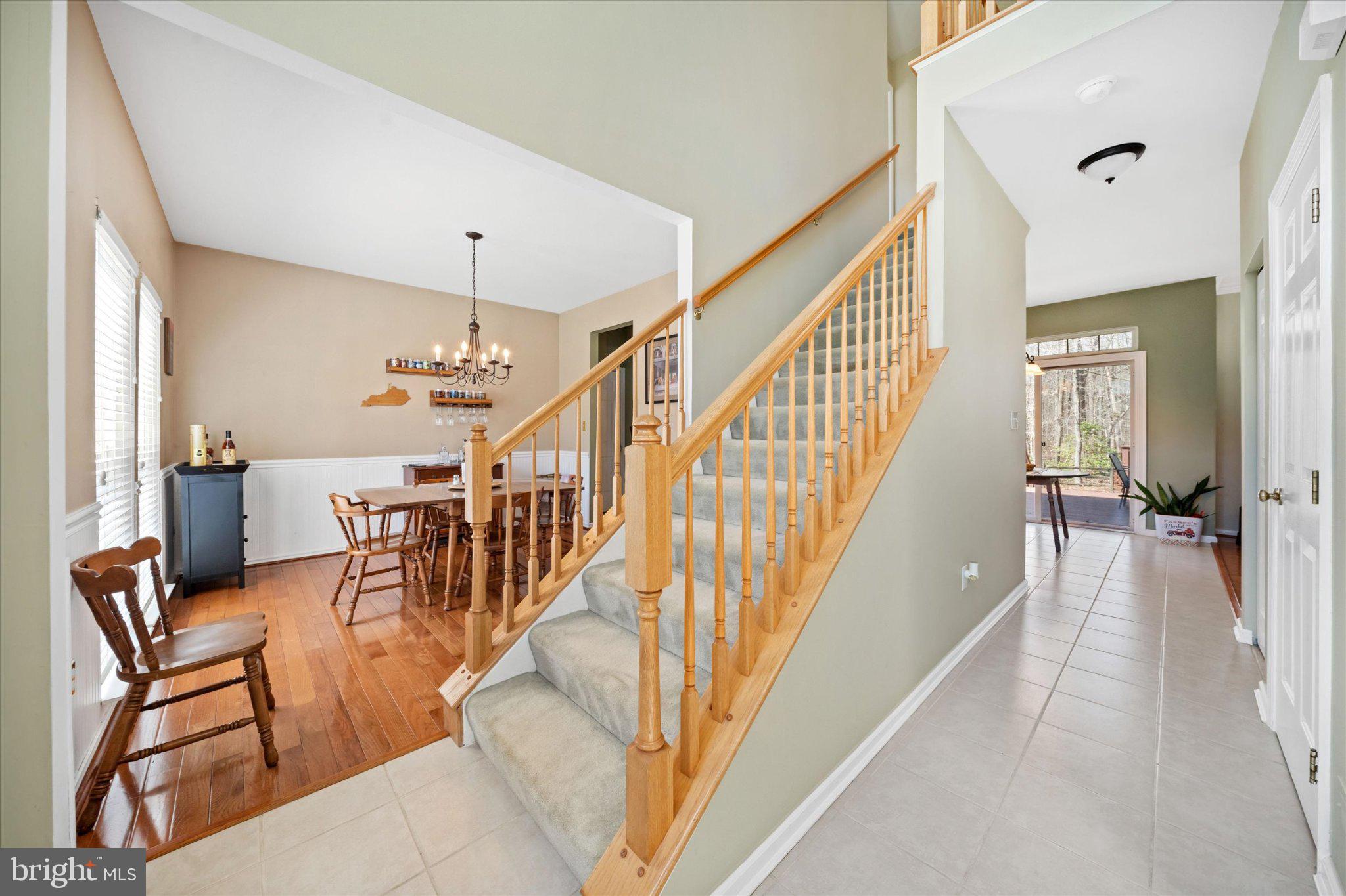 457 Preakness Run Newark, DE 19702 - Photo 23 of 55 a view of staircase and living room with wooden floor