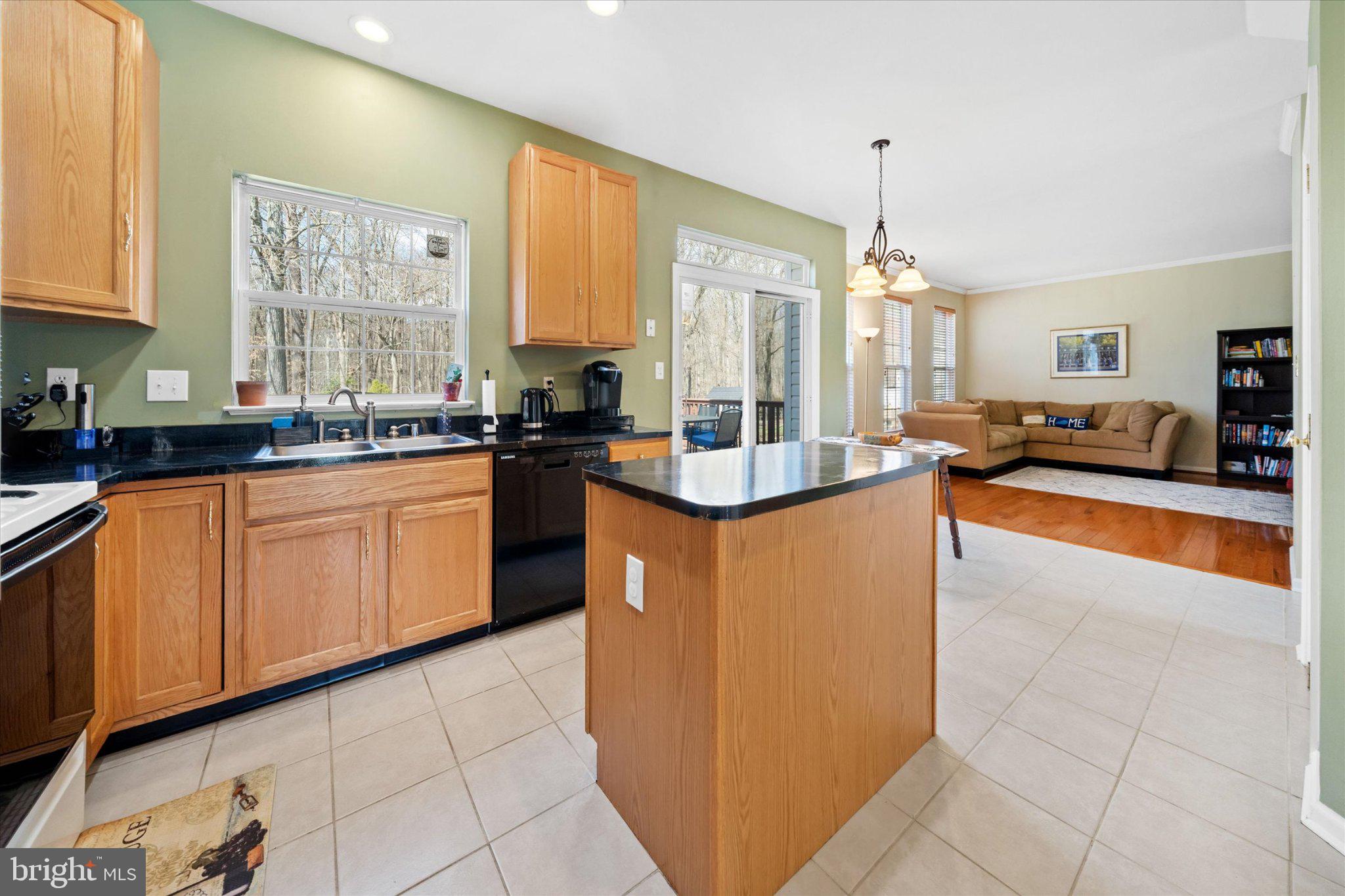 457 Preakness Run Newark, DE 19702 - Photo 35 of 55 a kitchen with stainless steel appliances granite countertop a sink counter space cabinets and a large window