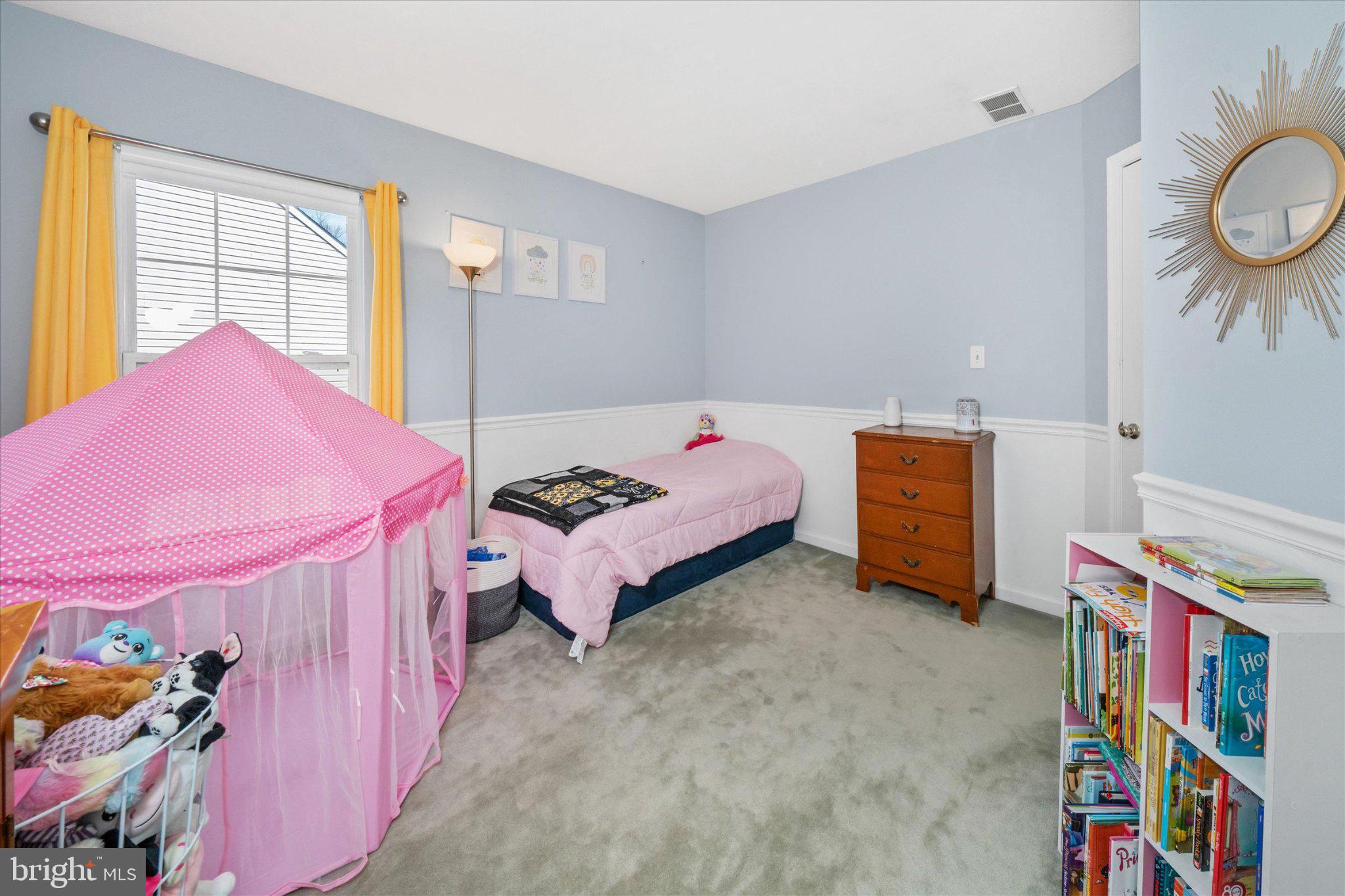 457 Preakness Run Newark, DE 19702 - Photo 43 of 55 a bedroom with a bed and a chandelier