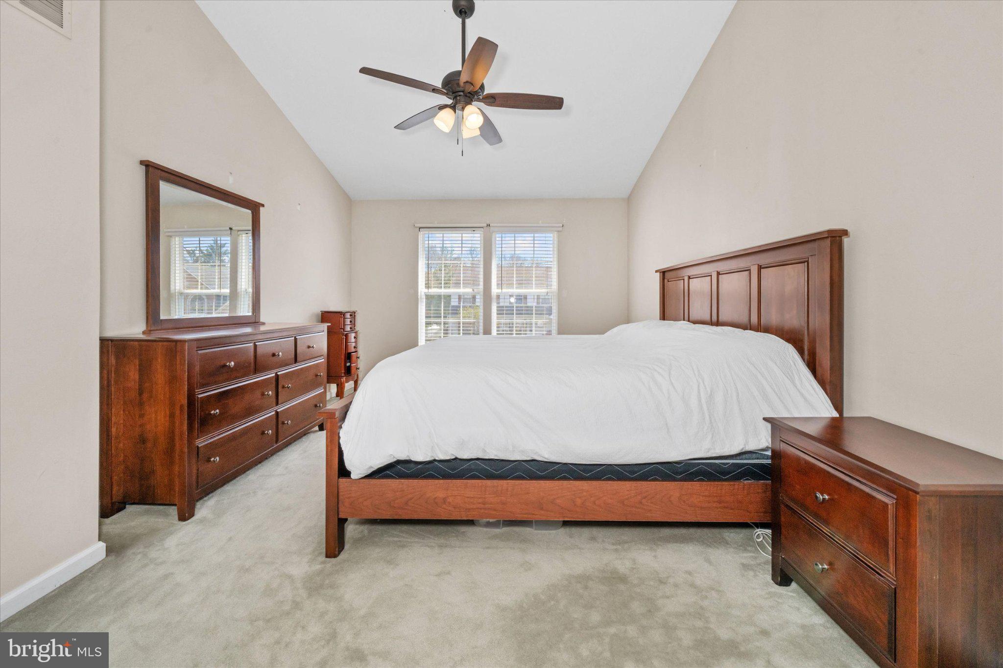 457 Preakness Run Newark, DE 19702 - Photo 46 of 55 a bedroom with a bed and a chandelier