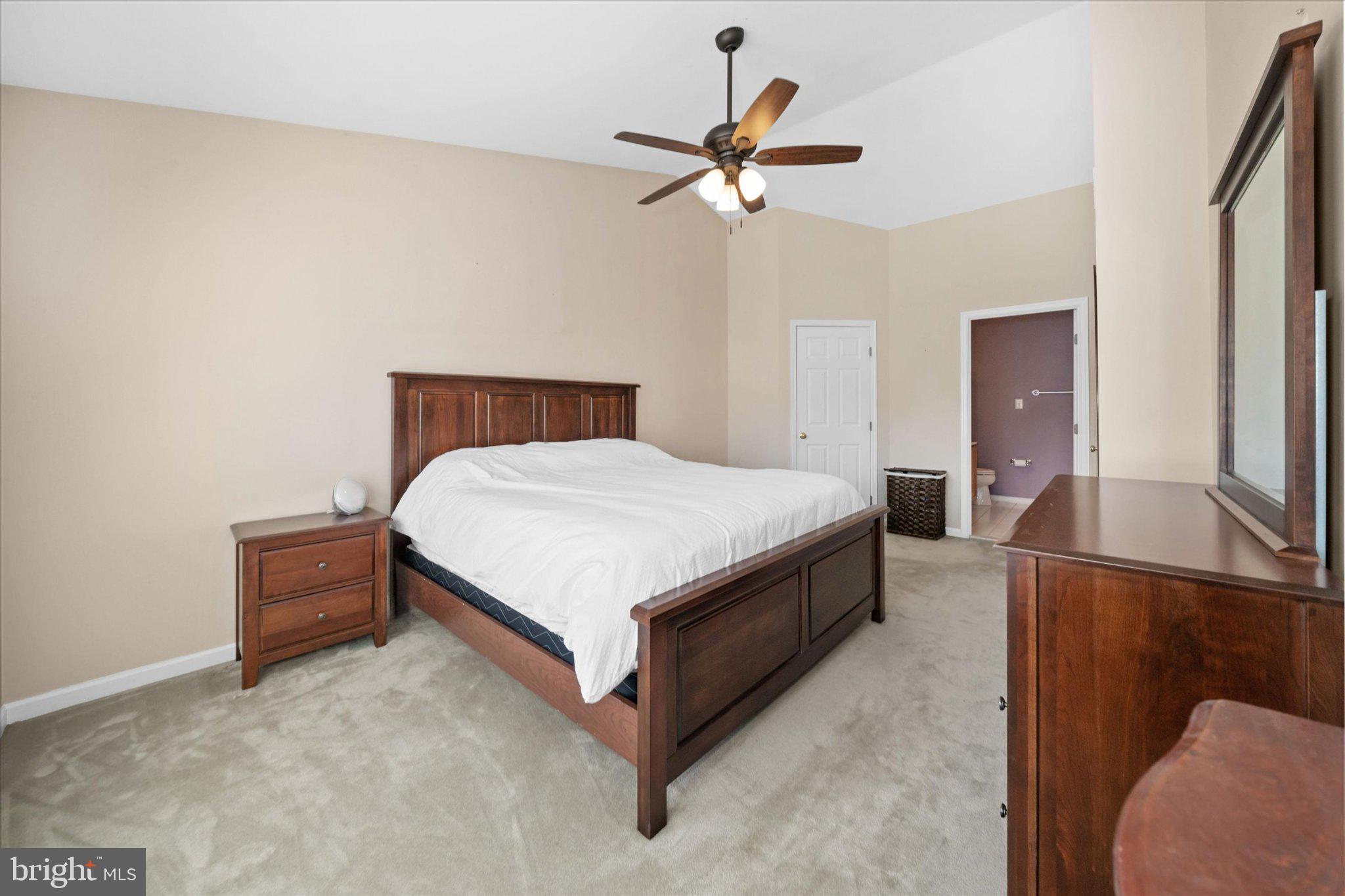 457 Preakness Run Newark, DE 19702 - Photo 47 of 55 a bedroom with a bed and a chandelier