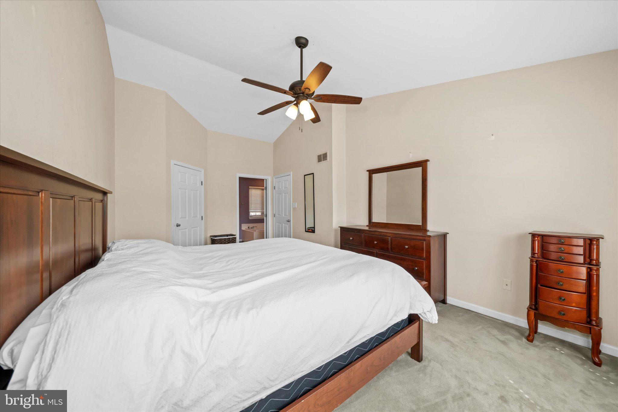 457 Preakness Run Newark, DE 19702 - Photo 48 of 55 a bedroom with a bed and a chandelier