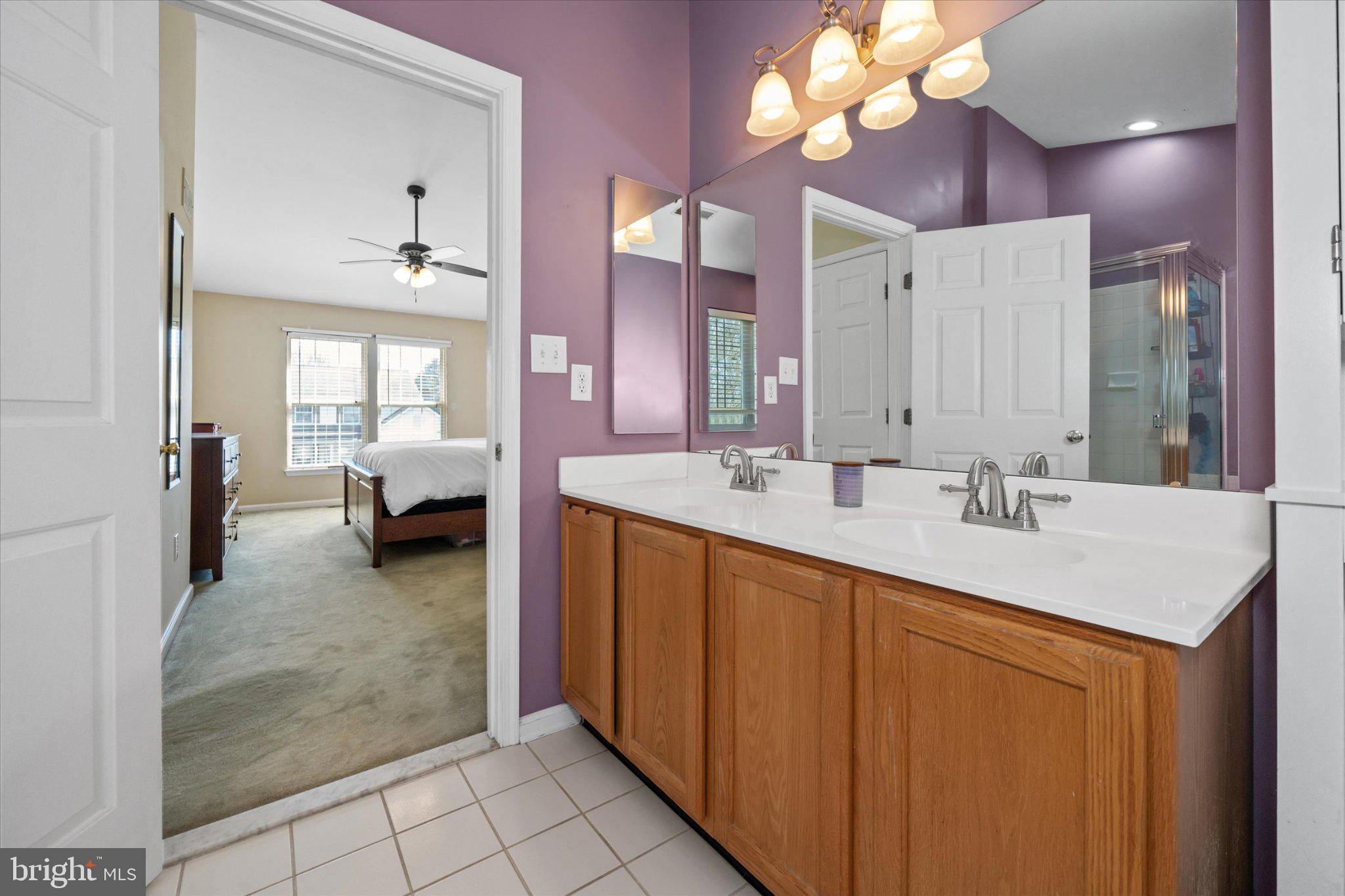 457 Preakness Run Newark, DE 19702 - Photo 49 of 55 a en suite bathroom with a sink double vanity and a mirror