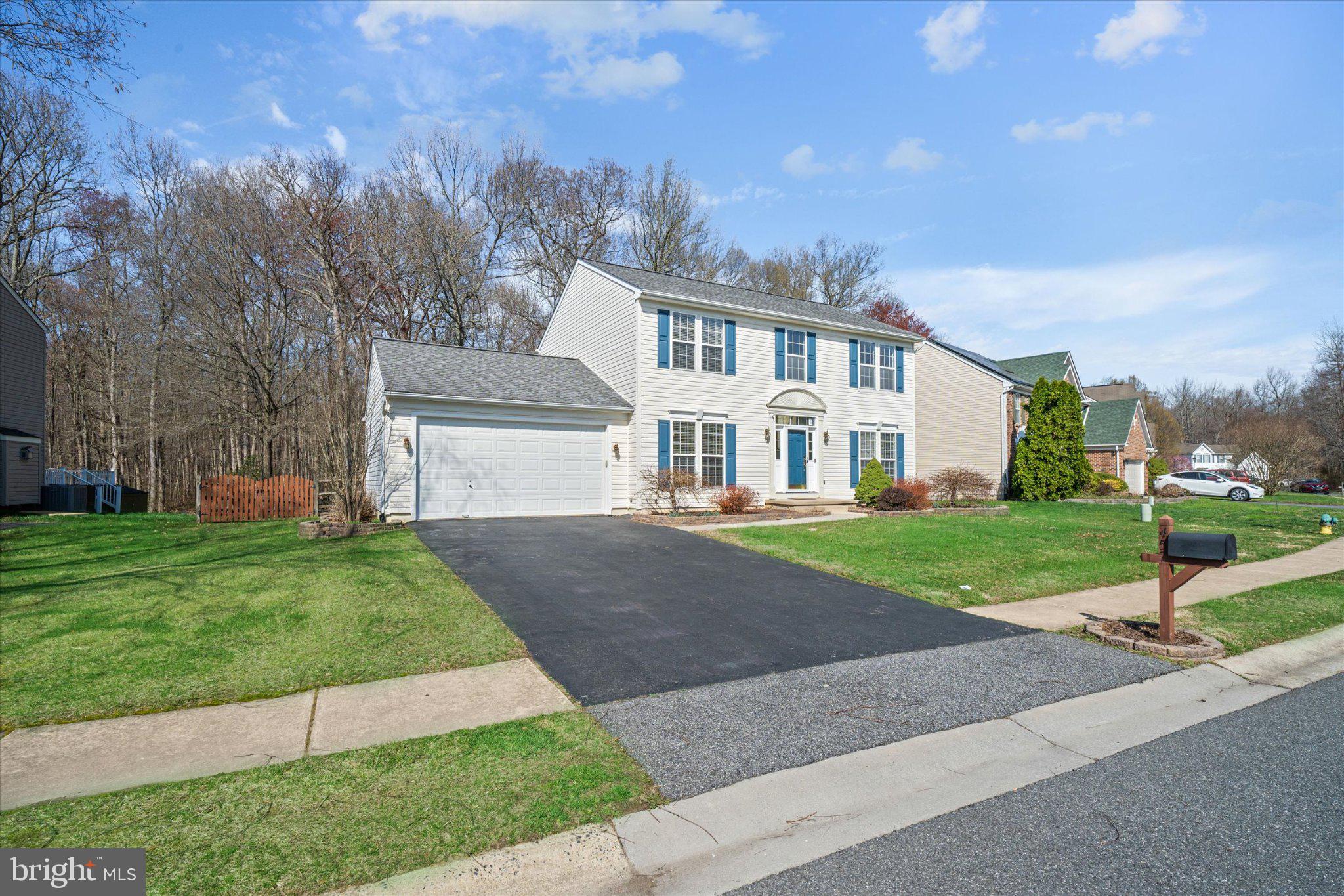 457 Preakness Run Newark, DE 19702 - Photo 5 of 55 a front view of a house with a yard and garage